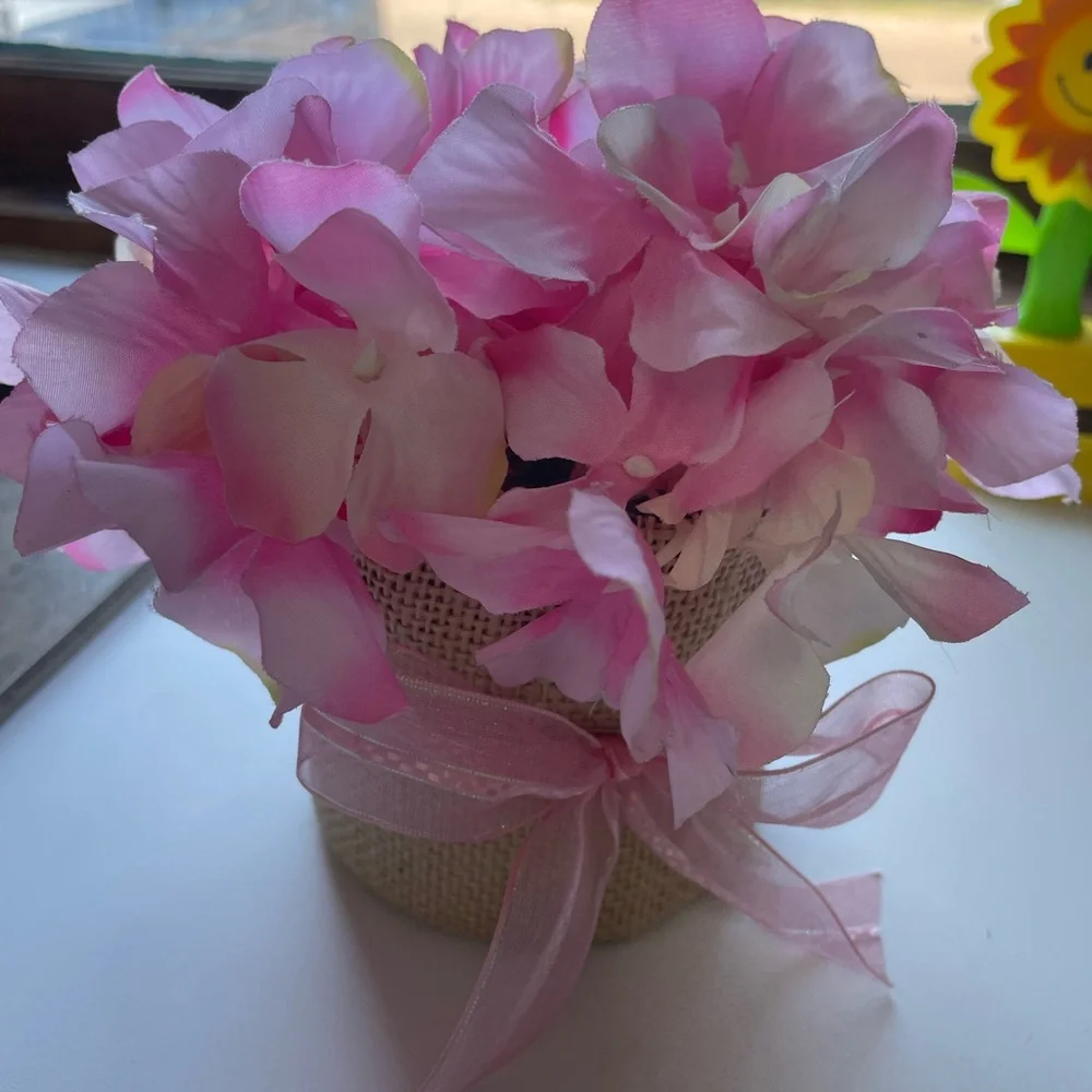 Small Bouquet of Pink Artificial Flowers with a Burlap Pot